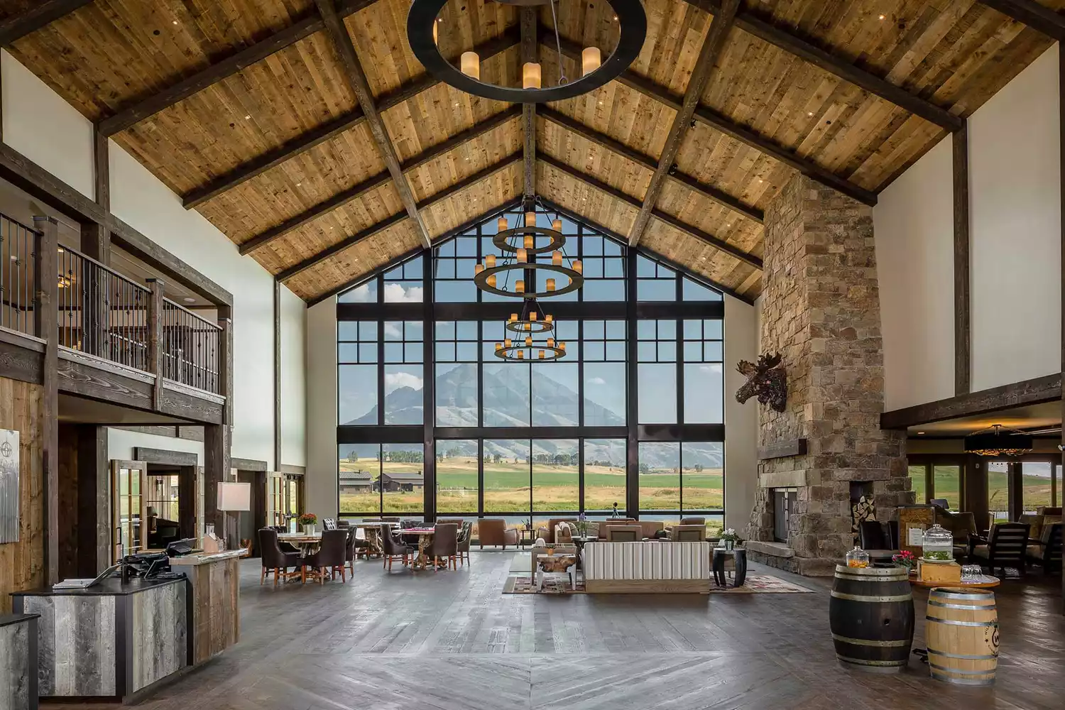 The grand lobby at Sage Lodge featuring floor-to-ceiling windows and comfortable seating.
