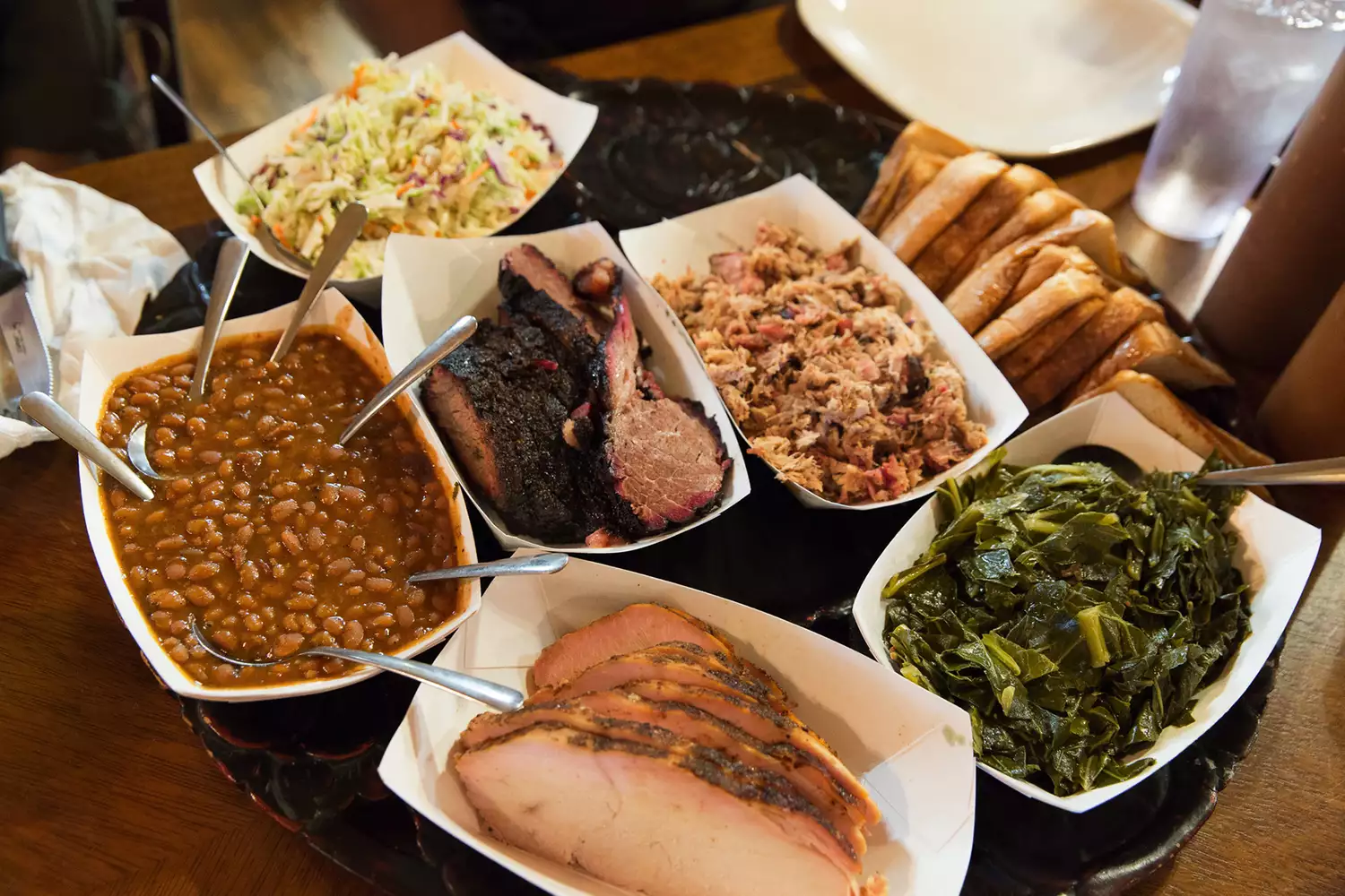 A large platter of smoked meats and classic southern sides from Haywood Smokehouse.