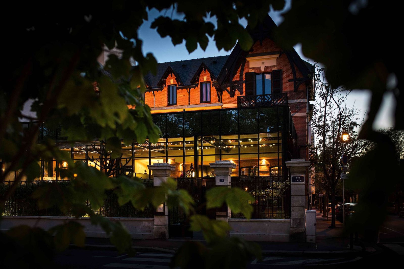 Modern building with hotel or resort lighting at dusk in an urban wellness district.