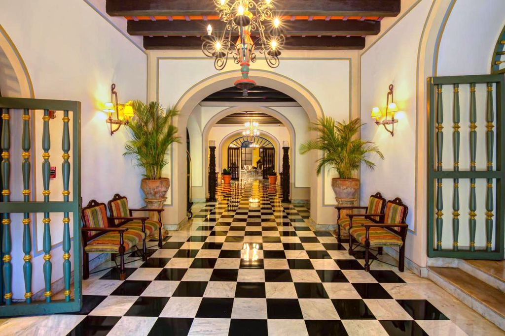 The yellow facade and historic Spanish Colonial architecture of Hotel El Convento in Old San Juan.