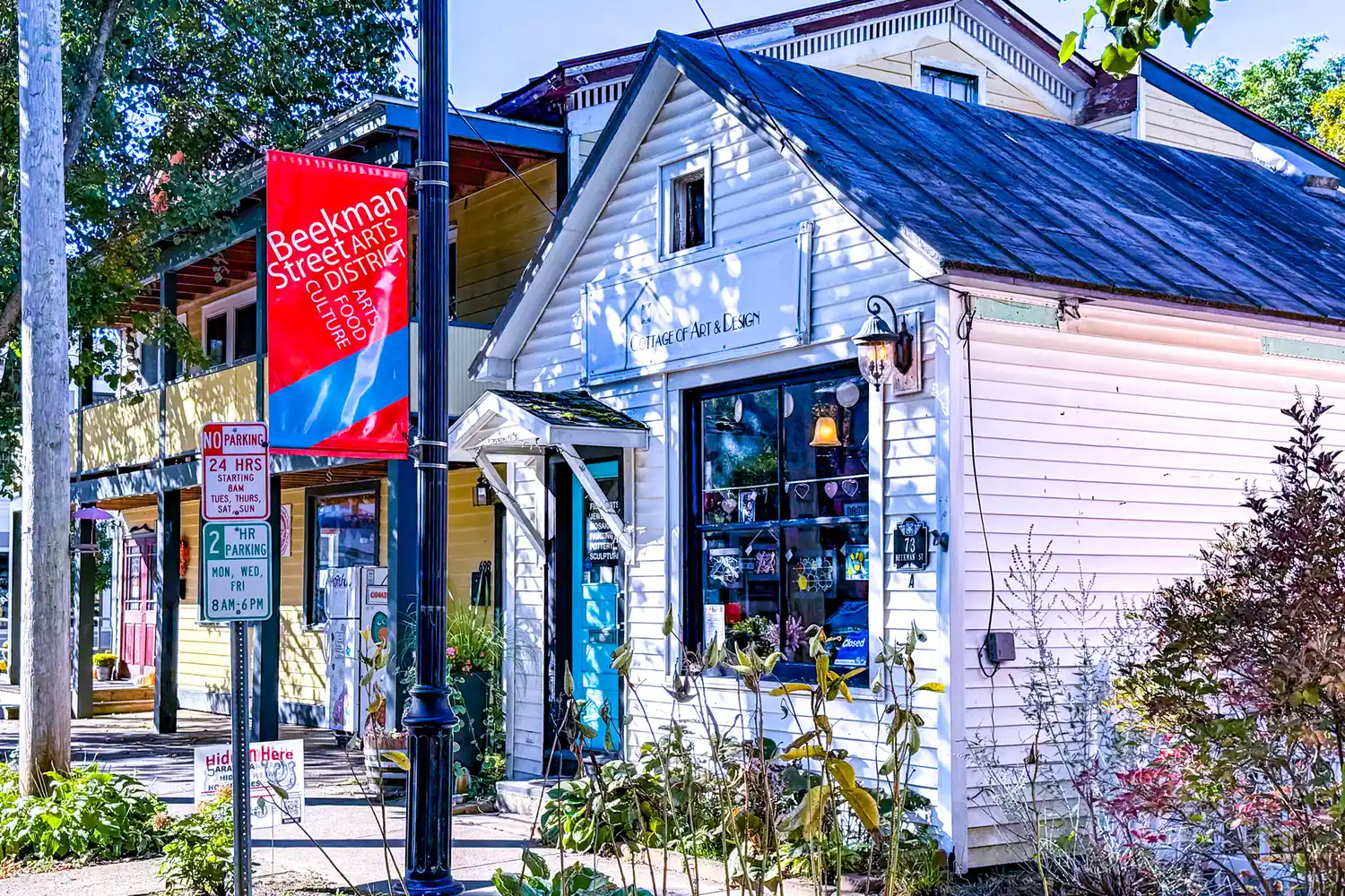 Colorful banners and storefronts in the Beekman Street Arts District of Saratoga Springs.