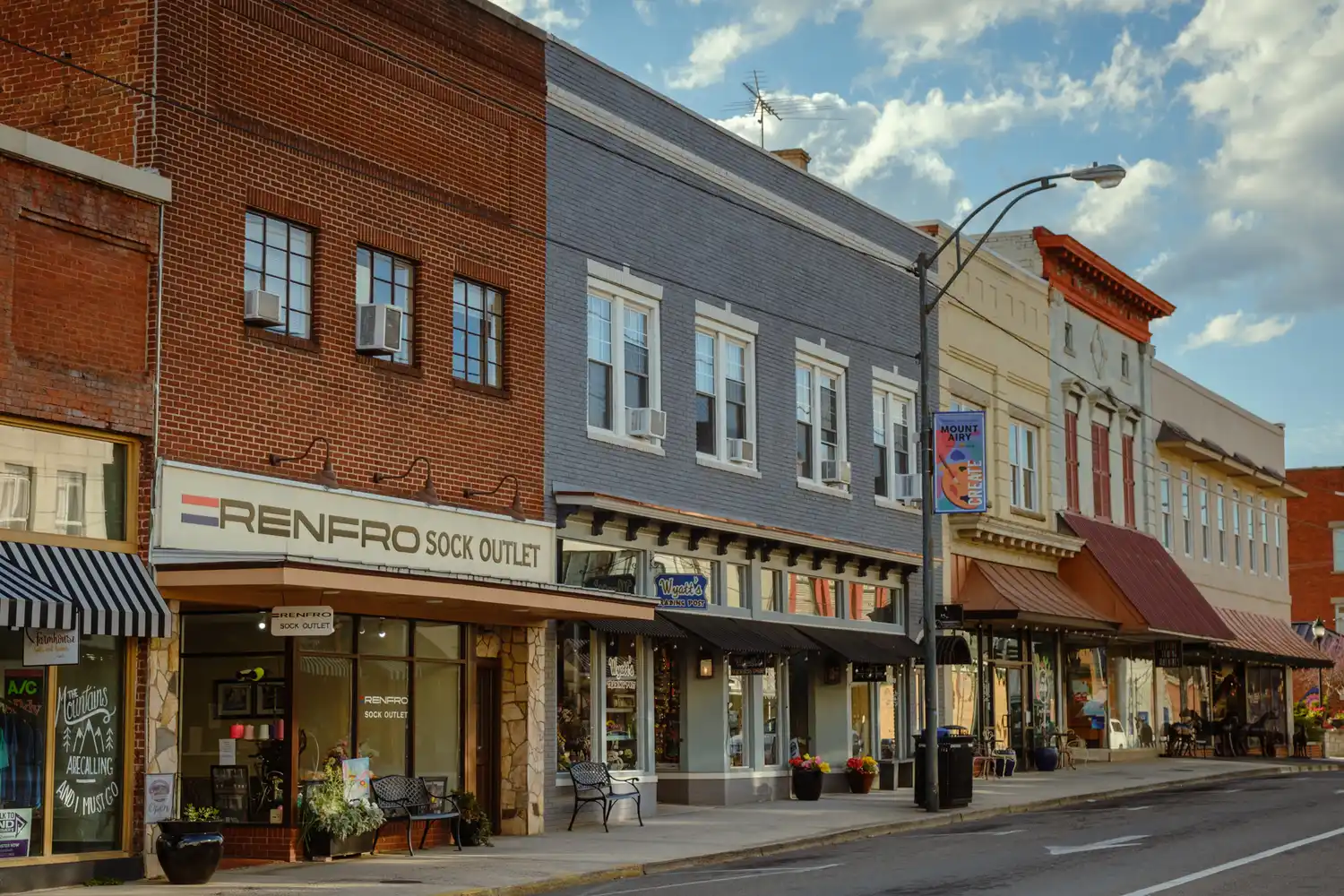 Street view of historic storefronts on Main Street including the Renfro Sock Outlet.