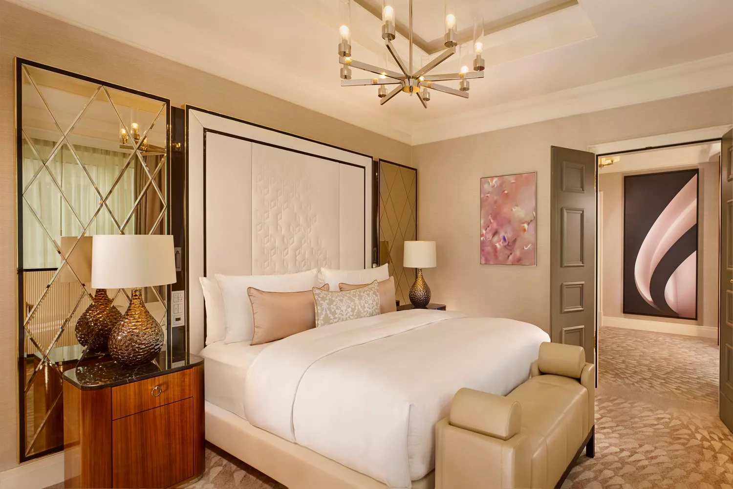 A sophisticated guest room at The Ritz-Carlton Berlin featuring elegant furniture and modern amenities.