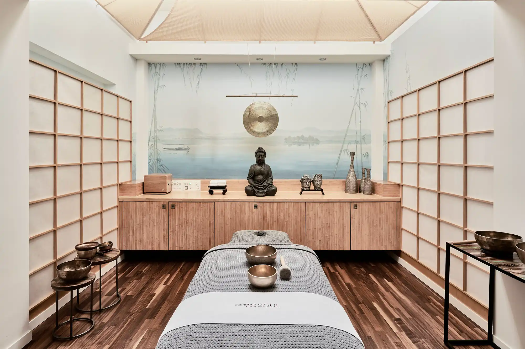 A minimalist and serene medical spa treatment room with modern equipment and a Zen-like atmosphere.