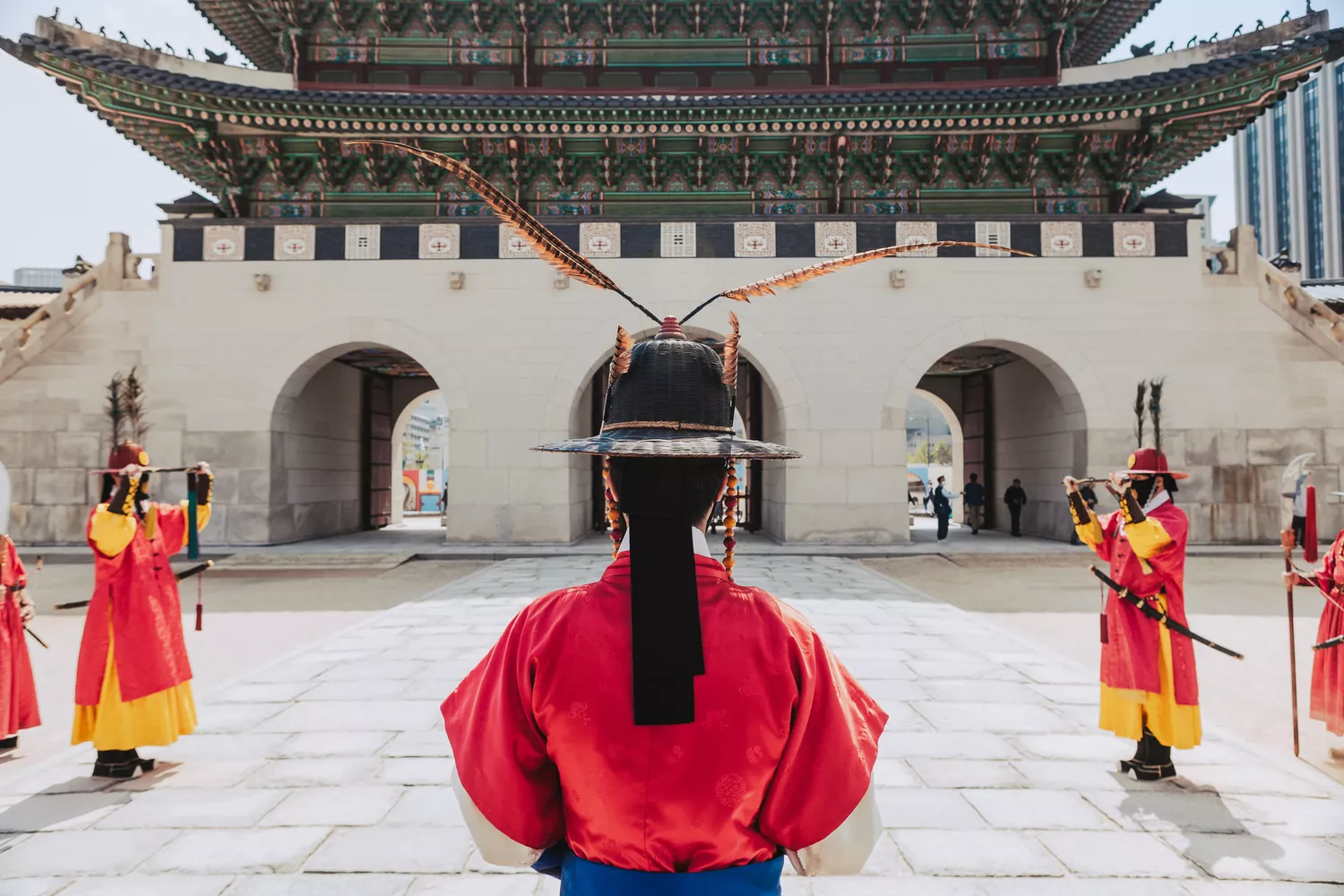 Royal guards in traditional Joseon Dynasty attire standing at a palace gate.