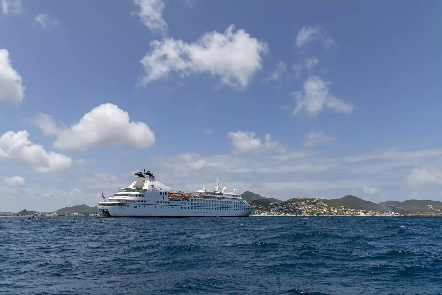 The exterior profile of the Windstar Star Breeze boutique cruise ship at sea.