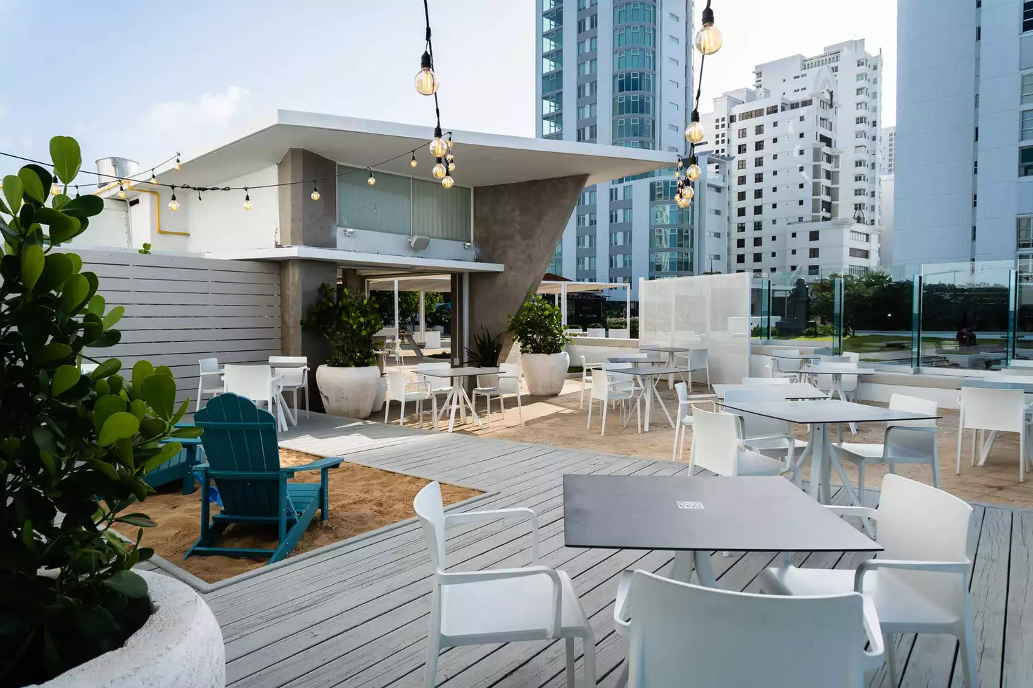 A modern outdoor terrace at Condado Ocean Club overlooking the Atlantic Ocean.