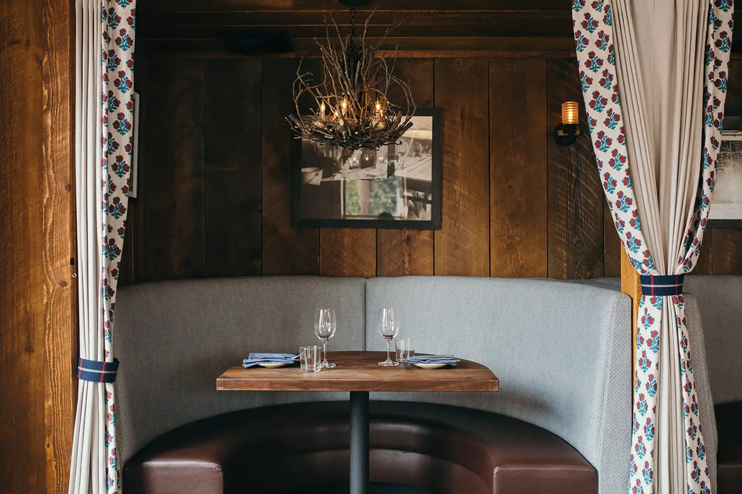 A cozy, private dining booth inside the Oyster Club restaurant.