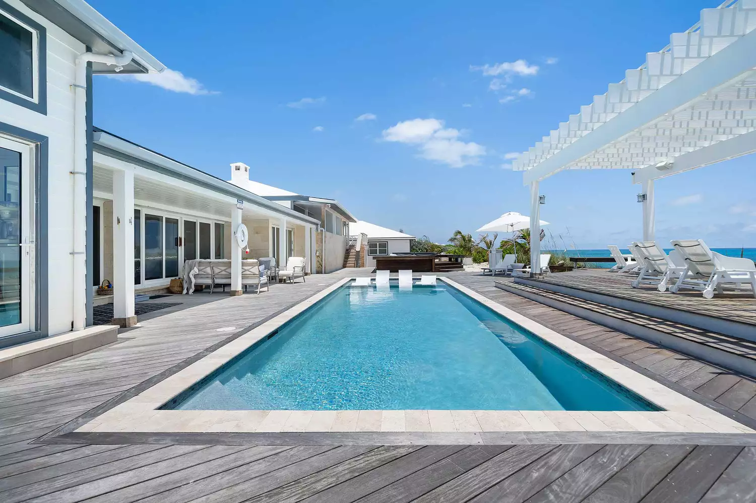A peaceful pool deck overlooking the water at a boutique hotel in Elbow Cay.