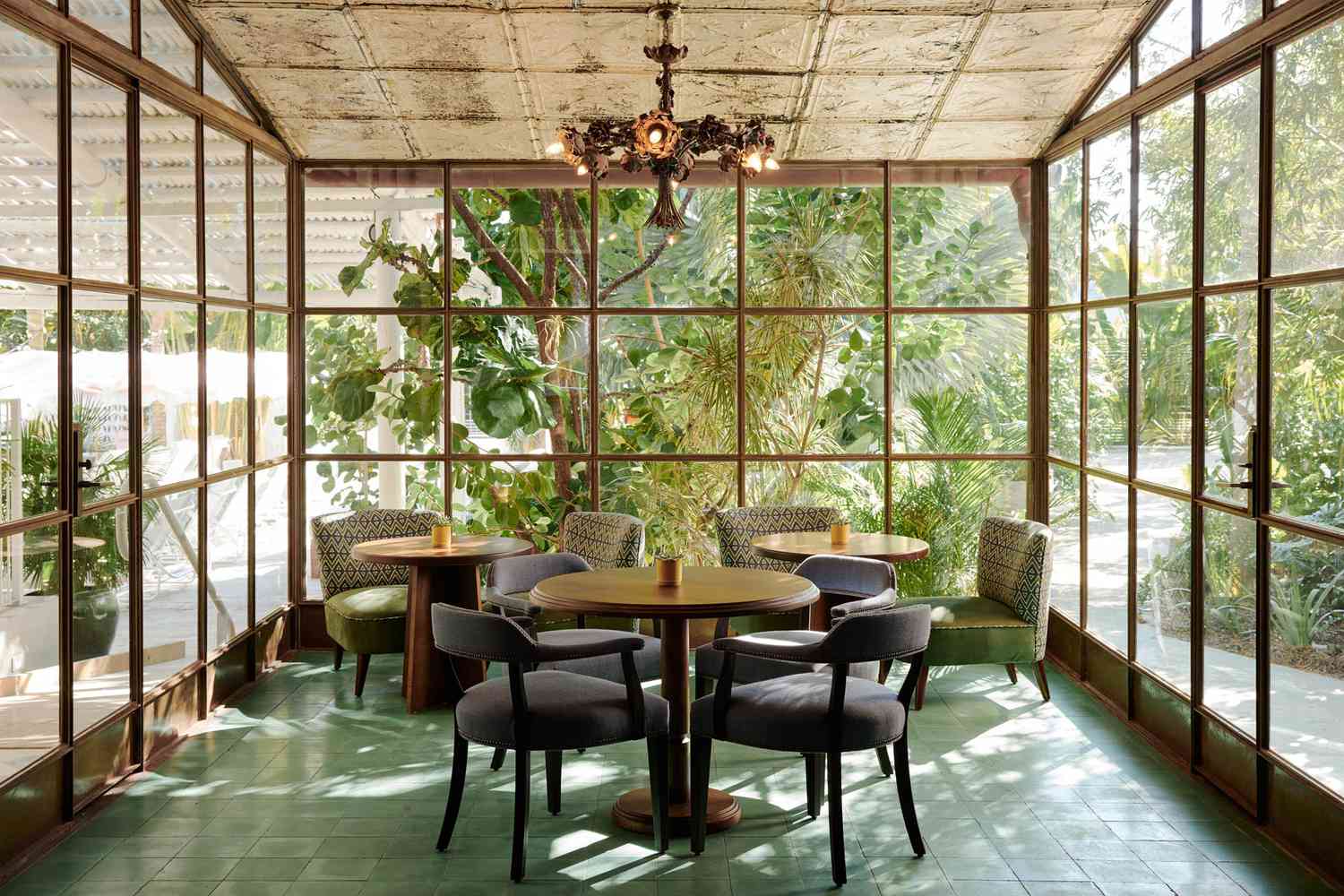 A wide-angle featured shot of the Miami Pool House interior and social spaces.