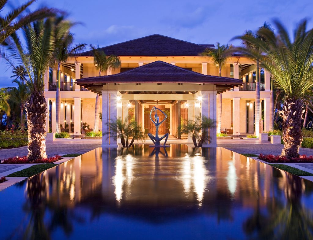 Dolphin-gray and white elegant furniture within a luxury suite at St. Regis Bahia Beach Resort.
