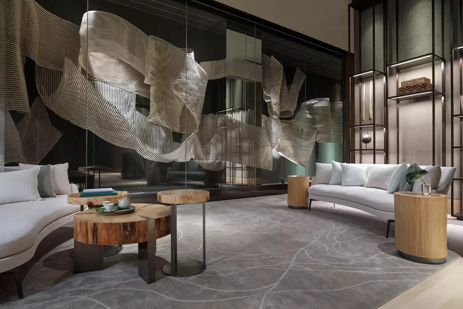 Modern and elegant lounge seating at Four Seasons Hotel Tokyo at Otemachi with floor-to-ceiling windows.