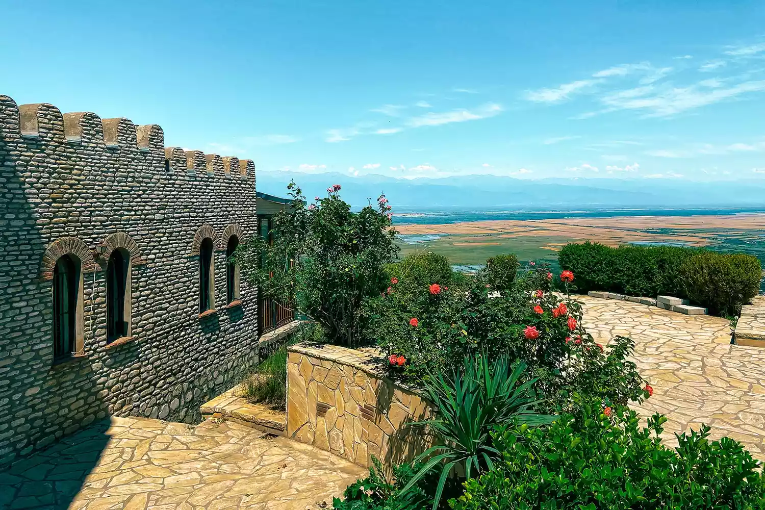 A scenic view of the red-roofed town of Signagi overlooking the Alazani Valley.