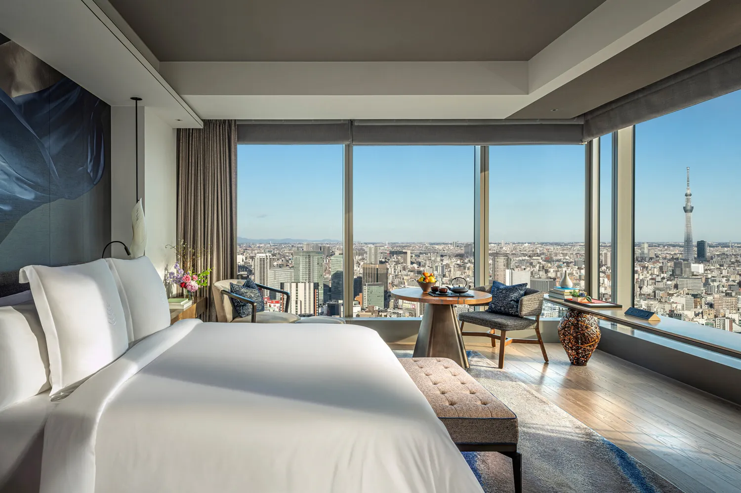 High-rise luxury hotel room overlooking the Tokyo skyline.
