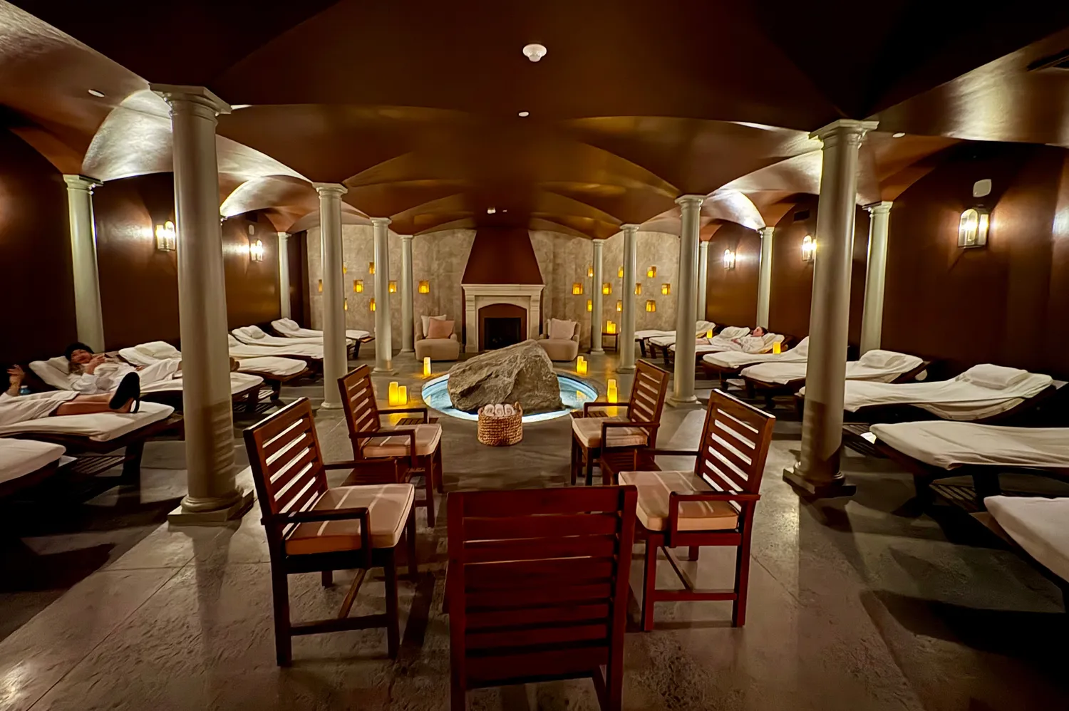 A serene spa lounge area with comfortable seating and soft lighting.