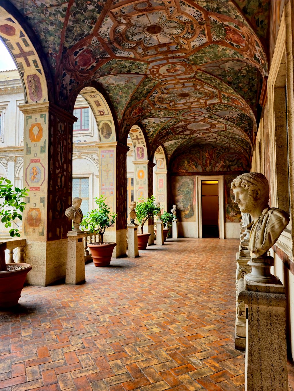 Decorative loggia and frescoed ceilings in the courtyard of Palazzo Altemps.