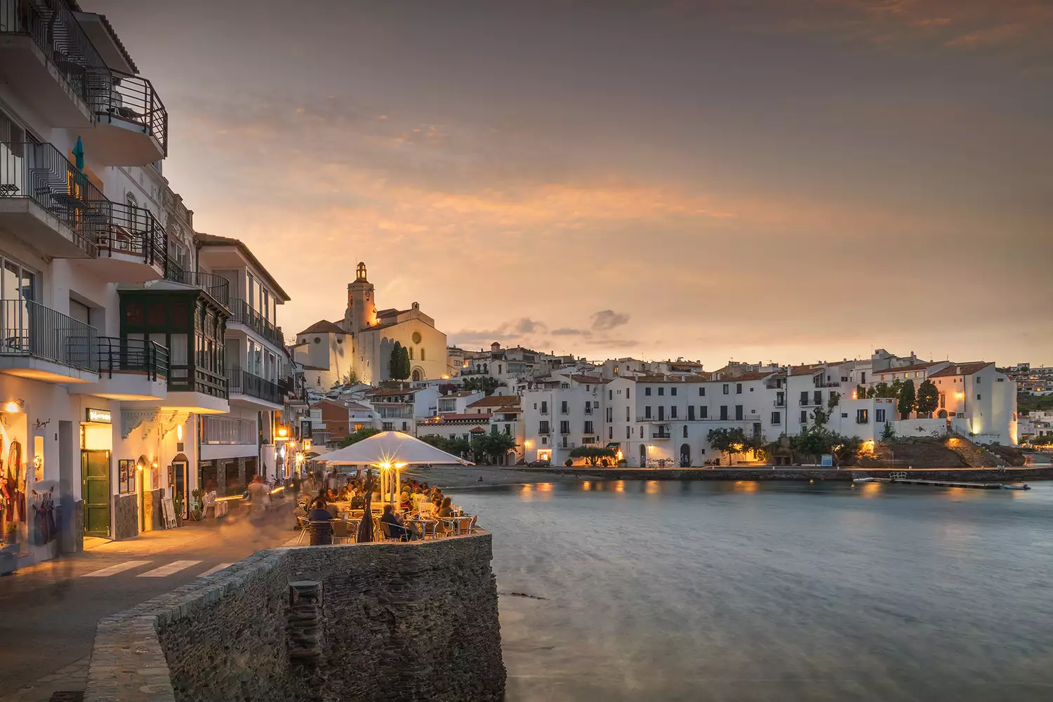 The white houses of the village of Cadaqués gathered around the coastline of the Costa Brava.