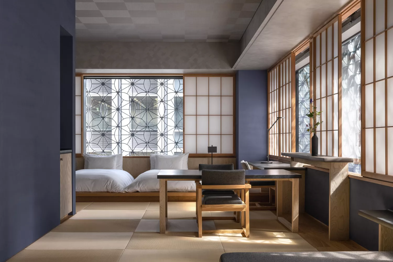 A luxury hotel room with tatami matting and low-profile Japanese furniture.