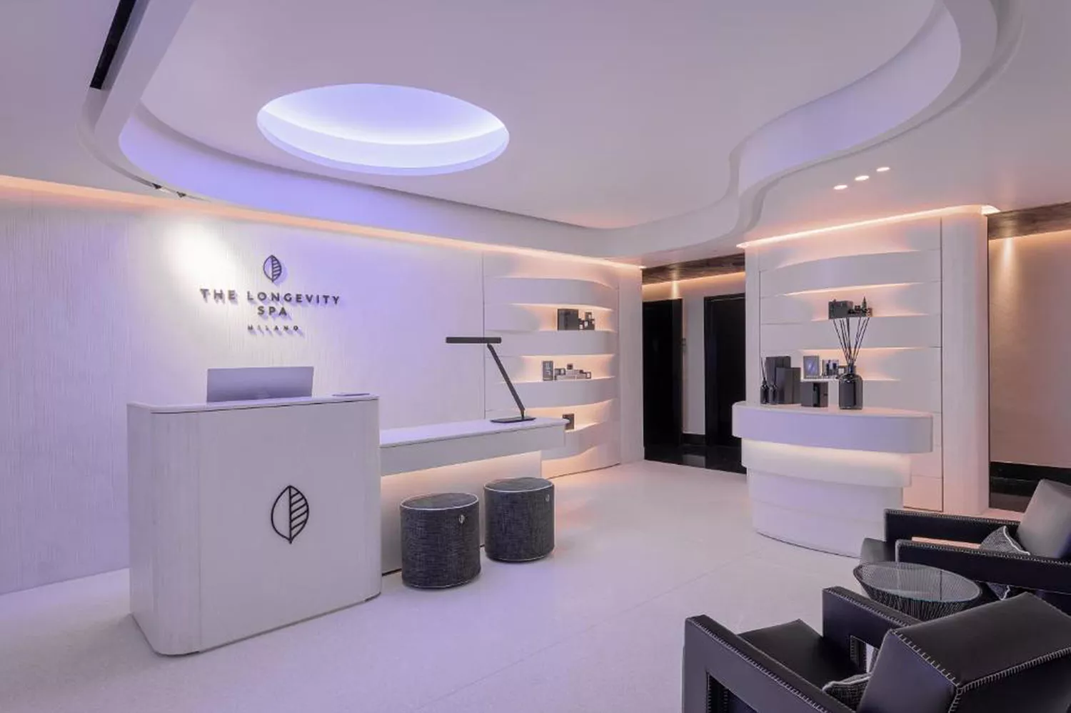 The contemporary interior reception and lounge area of the Venice Longevity Spa.