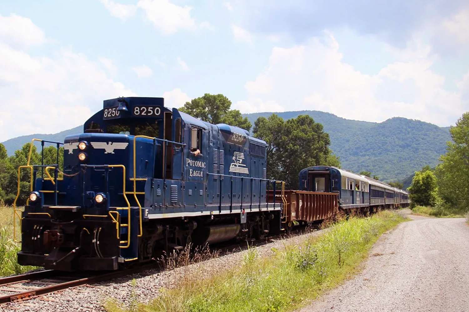 Aerial-style view of the Potomac Eagle train winding through the narrow Trough canyon with no roads in sight.