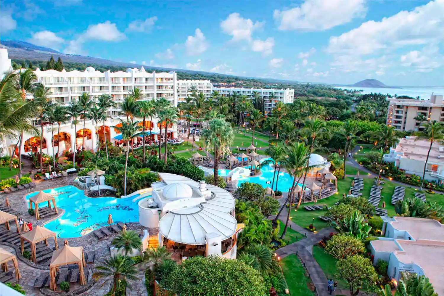The iconic white towers of Fairmont Kea Lani overlooking the Maui coastline.