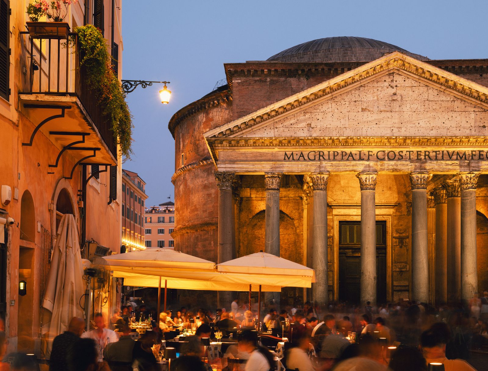 An traveler standing in the square before the historic Pantheon in Rome.