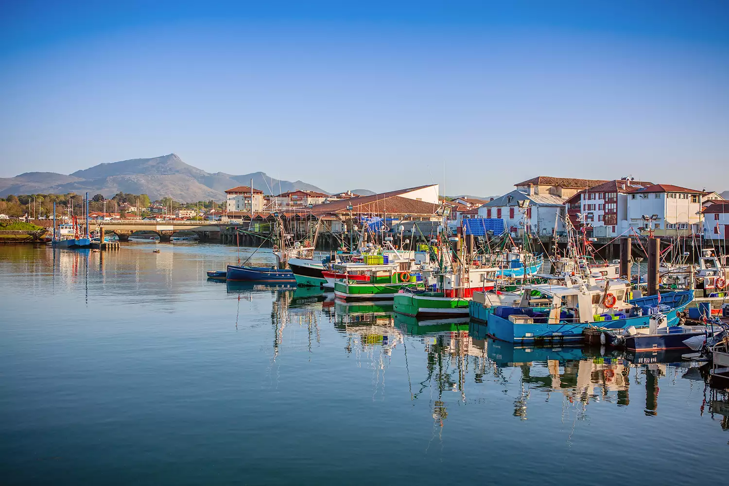 Traditional fishing boats moored in the harbor of Saint Jean de Luz, France.