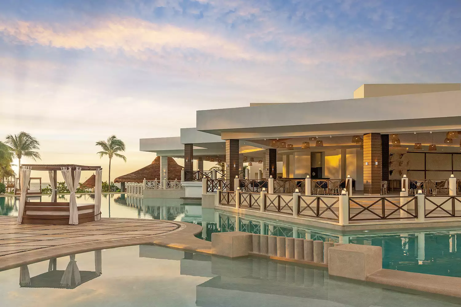 View of the multi-tiered swimming pools at Hyatt Ziva Riviera Cancun.