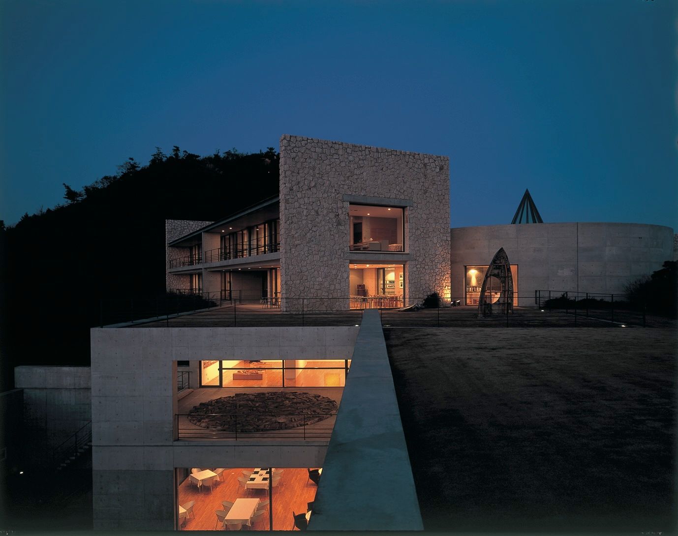 Modern luxury villa architecture featuring an indoor-outdoor pool design with clean architectural lines.