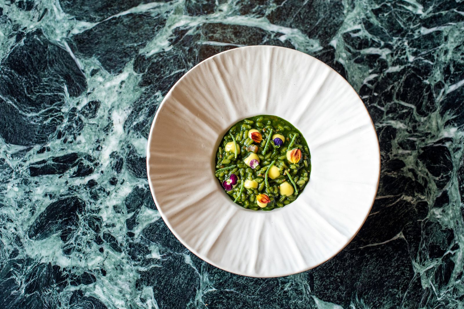 A vibrant and creative food presentation on a designer plate.