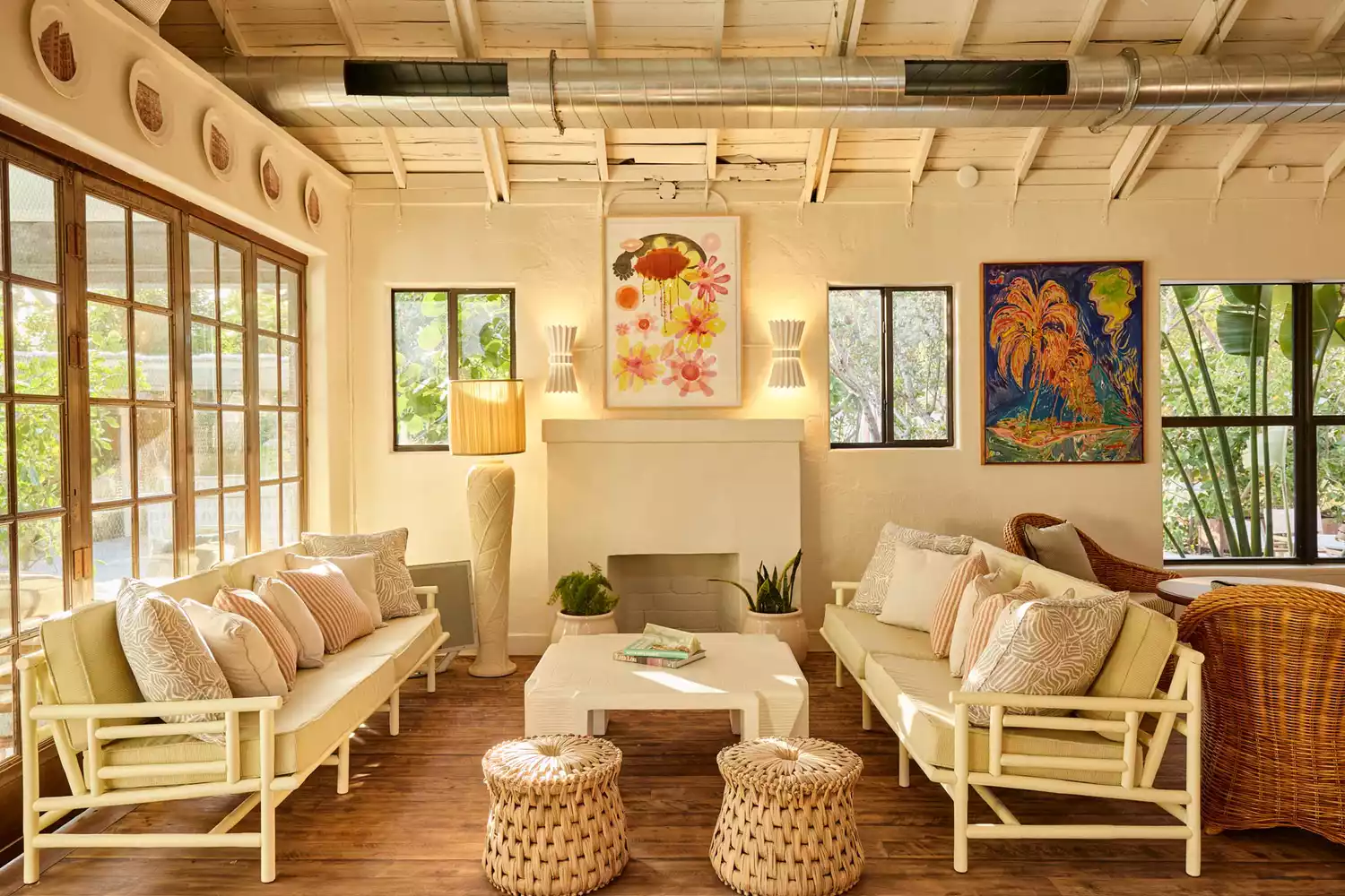Warm-toned interior of The Cottage at Miami Pool House with comfortable lounge seating.
