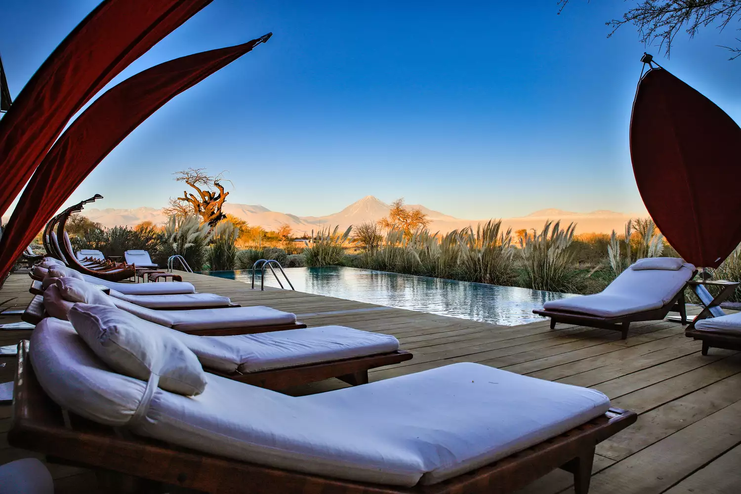The outdoor pool area at Tierra Atacama overlooking the desert.