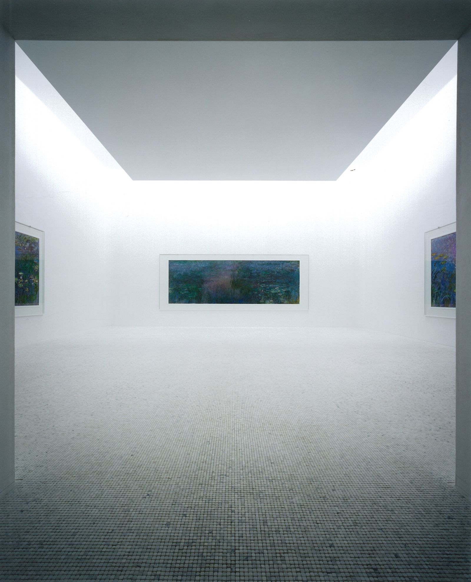 Minimalist art gallery interior with smooth flooring and soft natural lighting creating an ethereal space.